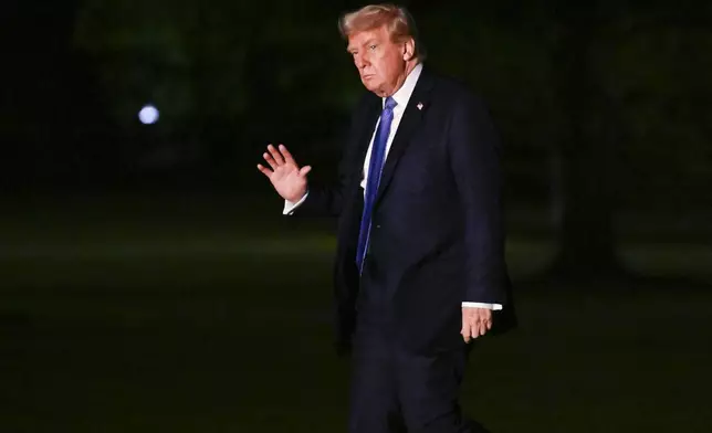 President Donald Trump waves as he arrives on the South Lawn of the White House, Thursday, April. 24, 2025, in Washington. (AP Photo/John McDonnell)