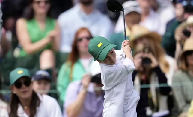 Jordan Spieth's son Sammy swings a club during the par-3 contest at the Masters golf tournament, Wednesday, April 9, 2025, in Augusta, Ga. (AP Photo/George Walker IV)