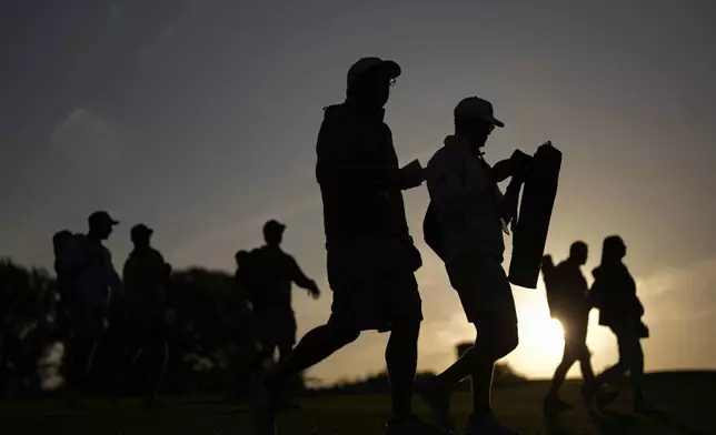 Patrons arrive for the first round at the Masters golf tournament, Thursday, April 10, 2025, in Augusta, Ga. (AP Photo/David J. Phillip)