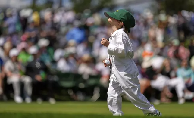 J.J. Spaun's daughter Emerson Lili, 5, runs along the 7th fairway during the par-3 contest at the Masters golf tournament, Wednesday, April 9, 2025, in Augusta, Ga. (AP Photo/Julia Demaree Nikhinson)