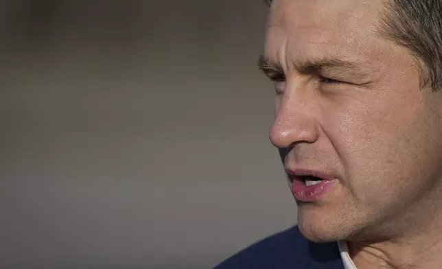 Conservative leader Pierre Poilievre arrives at Kelowna International Airport, in Kelowna, B.C., April 4, 2025. (Darryl Dyck/The Canadian Press via AP File)