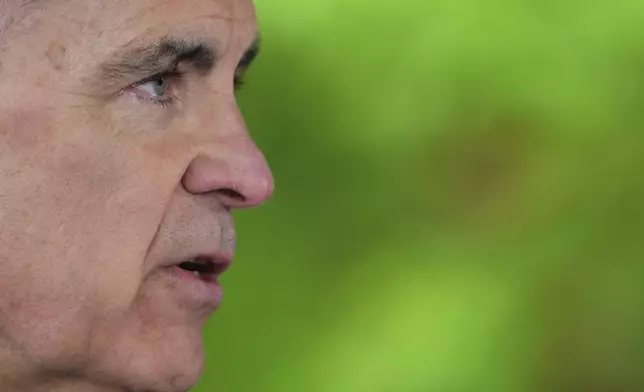 FILE - Prime Minister Mark Carney takes questions from the media in Saanichton, British Columbia, Canada, April 7, 2025. (Sean Kilpatrick/The Canadian Press via AP File)