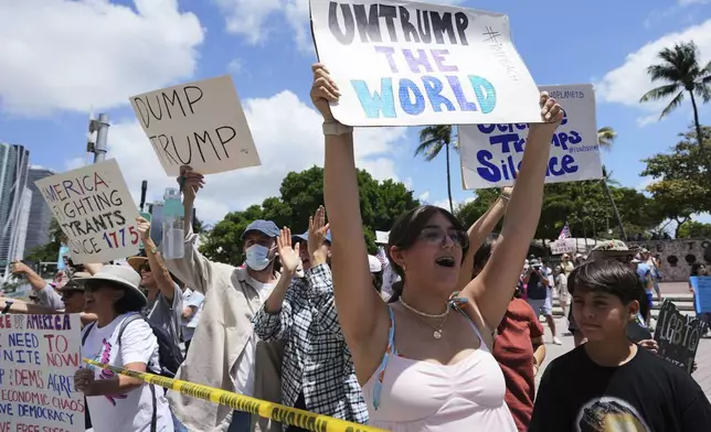 Amelie Gayoso chants slogans during a protest against the Trump administration, Saturday, April 19, 2025, in Miami. (AP Photo/Lynne Sladky)