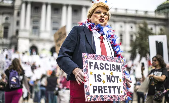 Protesters rally at the state capitol in Harrisburg, Pa., during the Day of Action protest against the Trump Administration. Saturday, April 19, 2025. (Zach Gleiter/The Patriot-News via AP)