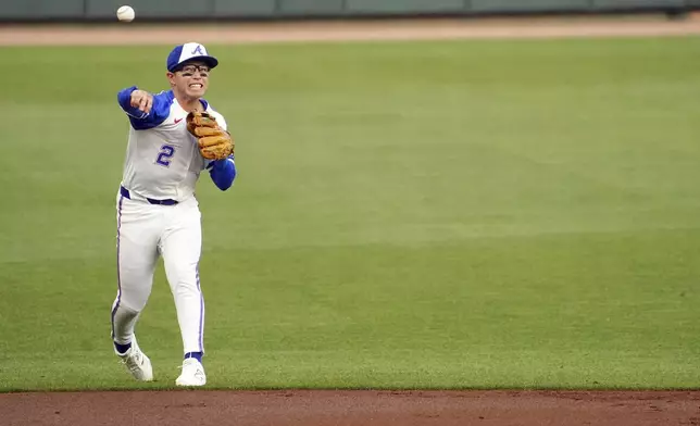 Atlanta Braves shortstop Nick Allen (2) fields a ground ball for an out against Minnesota Twins first base Ty France (13) during the first inning in a baseball game at Truist Park, Saturday, April 19, 2025, in Atlanta. (AP Photo/ John David Mercer)