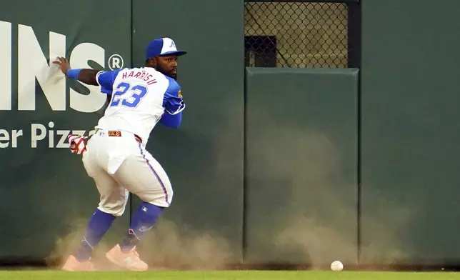 Atlanta Braves outfielder Michael Harris II misses a fly ball during the third inning of a baseball game against the Minnesota Twins, Saturday, April 19, 2025, in Atlanta. (AP Photo/John David Mercer)
