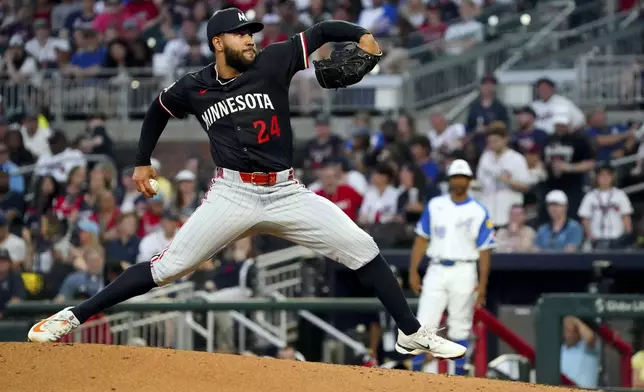 Minnesota Twins pitcher Simeon Woods Richardson delivers against the Atlanta Braves during the third inning of a baseball game Saturday, April 19, 2025, in Atlanta. (AP Photo/John David Mercer)