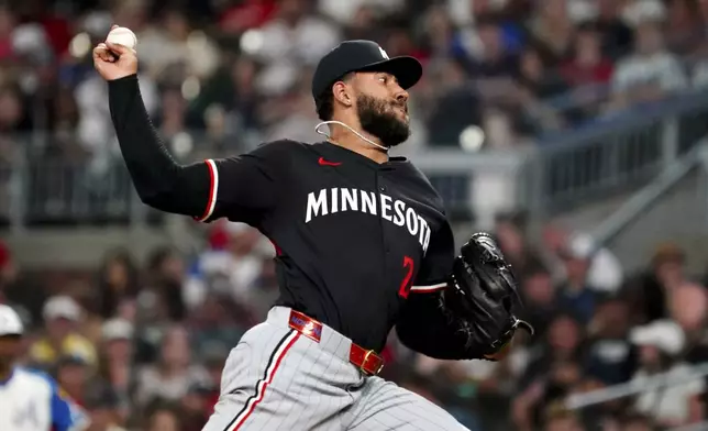Minnesota Twins pitcher Simeon Woods Richardson (24) cycles through a pitch against the Atlanta Braves during the fourth inning in a baseball game at Truist Park, Saturday, April 19, 2025, in Atlanta. (AP Photo/ John David Mercer)