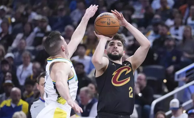 Cleveland Cavaliers guard Ty Jerome (2) shoots over Indiana Pacers guard T.J. McConnell (9) during the first half of an NBA basketball game in Indianapolis, Thursday, April 10, 2025. (AP Photo/Michael Conroy)