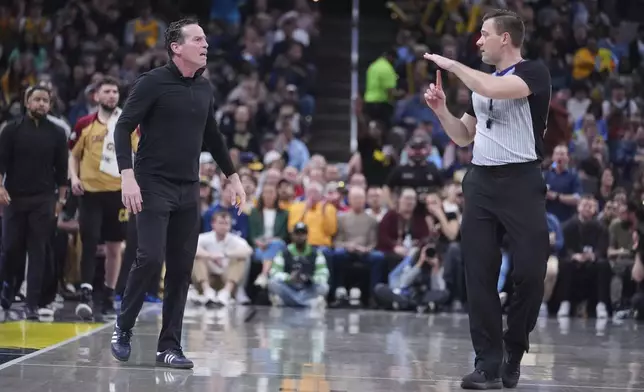 Cleveland Cavaliers head coach Kenny Atkinson receives a technical during the second half of an NBA basketball game against the Indiana Pacers in Indianapolis, Thursday, April 10, 2025. (AP Photo/Michael Conroy)