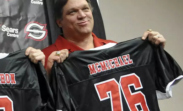 FILE - Former Chicago Bears defensive tackle Steve McMichael holds a Chicago Slaughter jersey during a news conference Feb. 19, 2010, in Chicago. (John J. Kim/Chicago Sun-Times via AP, File)