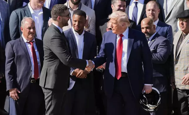 President Donald Trump, right, shakes the hand of Philadelphia Eagles coach Nick Sirianni, as Trump welcomes the Super Bowl champion NFL football team to the South Lawn of the White House, Monday, April 28, 2025, in Washington. (AP Photo/Alex Brandon)
