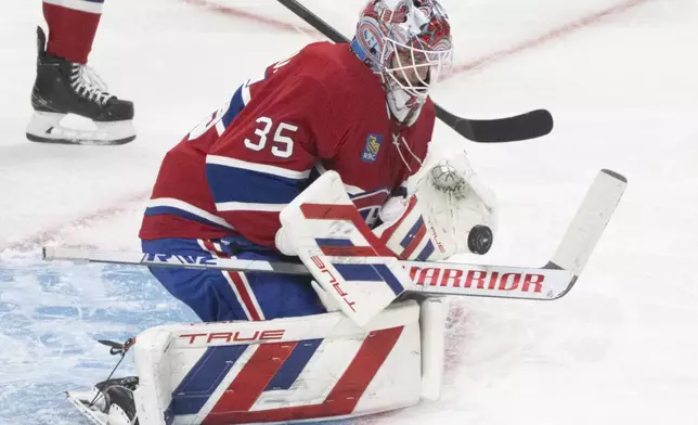 Montreal Canadiens goaltender Sam Montembeault (35) makes a save during the second period of Game 3 of a first-round NHL hockey playoff series against the Washington Capitals in Montreal, Friday, April 25, 2025. (Christinne Muschi/The Canadian Press via AP)