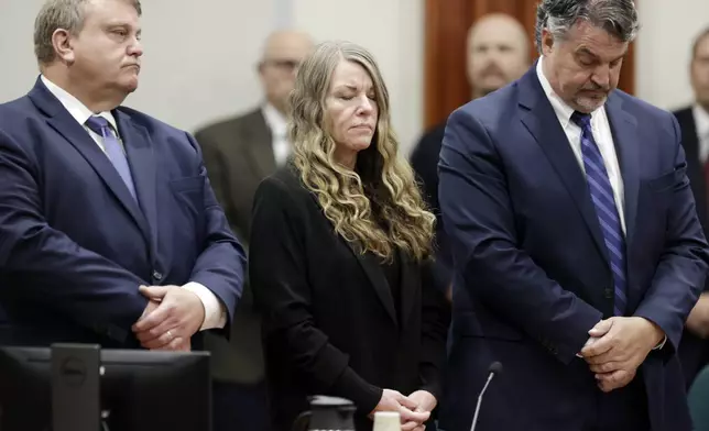 FILE - Lori Vallow Daybell stands and listens as the jury's verdict is read at the Ada County Courthouse in Boise, Idaho on Friday, May 12, 2023. Vallow Daybell faces up to life in prison without parole when she is expected to be sentenced Monday, July 31, in the murders of her two youngest children and a romantic rival. (AP Photo/Kyle Green, File)