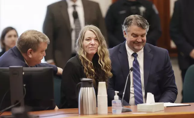 FILE - Lori Vallow Daybell talks with her lawyers before the jury's verdict is read at the Ada County Courthouse in Boise, Idaho on May 12, 2023. (AP Photo/Kyle Green, File)