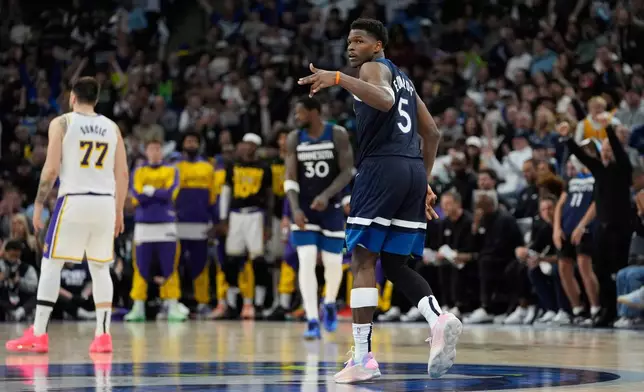 Minnesota Timberwolves guard Anthony Edwards (5) celebrates after making a 3-point shot during the second half of Game 4 of an NBA basketball first-round playoff series against the Los Angeles Lakers, Sunday, April 27, 2025, in Minneapolis. (AP Photo/Abbie Parr)