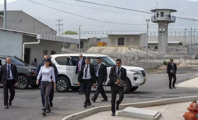 Homeland Security Secretary Kristi Noem, left, tours the Terrorist Confinement Center in Tecoluca, El Salvador, Wednesday, March 26, 2025. (AP Photo/Alex Brandon)
