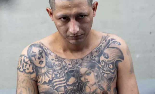 A prisoner at the Terrorist Confinement Center stands in Tecoluca, El Salvador, Wednesday, March 26, 2025, during a tour of the facility by U.S. Homeland Security Secretary Kristi Noem. (AP Photo/Alex Brandon)