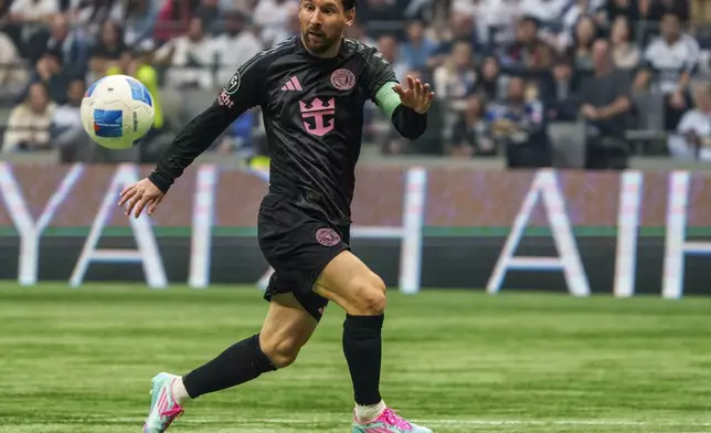 Inter Miami's Lionel Messi watches the ball during the first half of a CONCACAF Champions Cup semifinal soccer match against the Vancouver Whitecaps in Vancouver, British Columbia, Thursday, April 24, 2025. (Christopher Morris/The Canadian Press via AP)