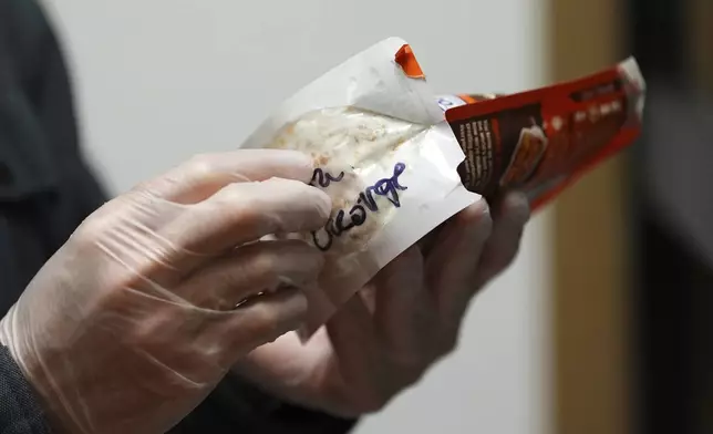 Matt Metzger, a Marine Corps combat veteran, displays an instant rice bag used to grow mushrooms for microdosing psilocybin Wednesday, March 26, 2025, in Olympia, Wash. (AP Photo/Lindsey Wasson)