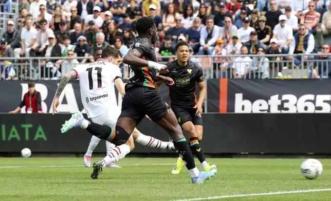 AC Milan's Christian Pulisic scores his side's opening goal during the Serie A soccer match between Venezia and AC Milan at the Pier Luigi Penzo Stadium, in Venice, Italy, Sunday, April 27, 2025. (Paola Garbuio/LaPresse via AP)