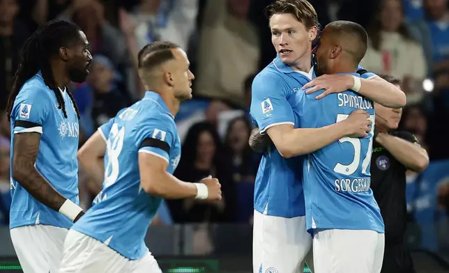 Napoli's Scott McTominay, second right, celebrates after scoring the opening goal during the Serie A soccer match between Napoli and Torino FC in Naples, Italy, Sunday, April 27, 2025. (Alessandro Garofalo/LaPresse via AP)