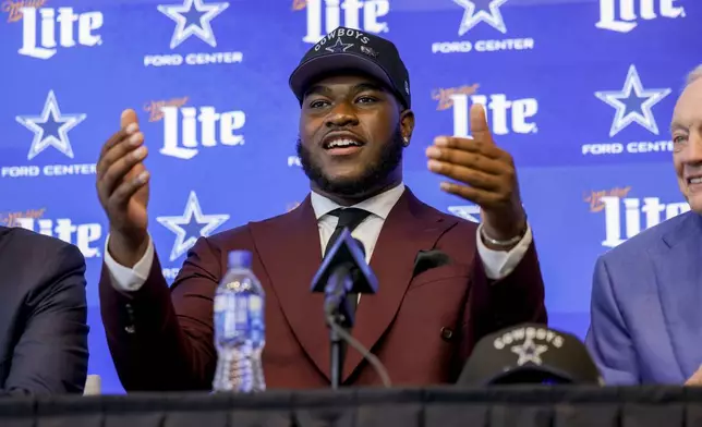 Dallas Cowboys' first round draft pick Tyler Booker speaks during an NFL football press conference in Frisco, Texas, Friday, April 25, 2025. (AP Photo/Gareth Patterson)