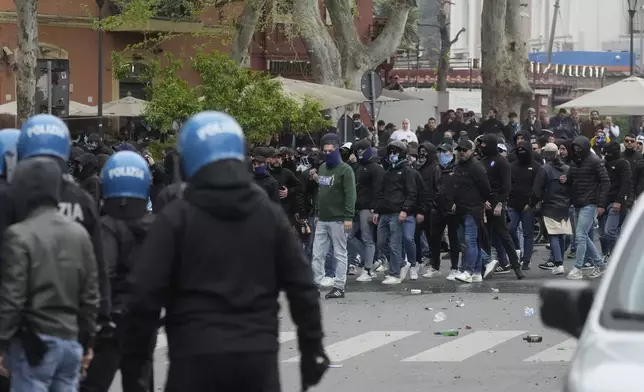 Lazio fans riot with police ahead of the Italian Serie A soccer match between Lazio and Roma at Rome's Olympic stadium, Sunday, April 13, 2025. (AP Photo/Gregorio Borgia)