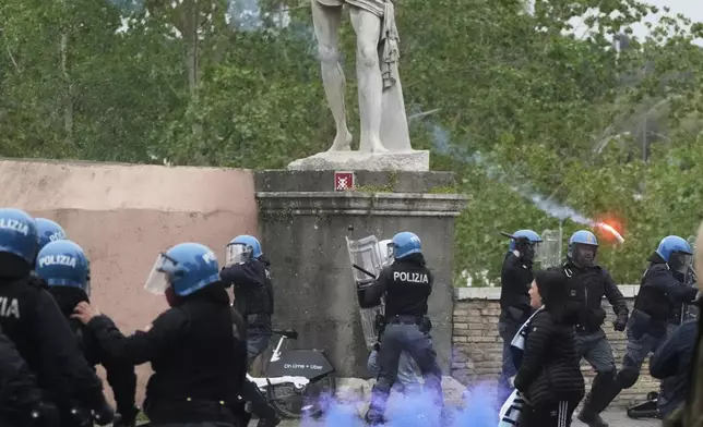 Lazio fans riot with police ahead of the Italian Serie A soccer match between Lazio and Roma at Rome's Olympic stadium, Sunday, April 13, 2025. (AP Photo/Gregorio Borgia)