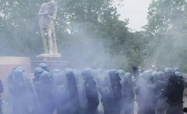 Lazio fans riot with police ahead of the Italian Serie A soccer match between Lazio and Roma at Rome's Olympic stadium, Sunday, April 13, 2025. (AP Photo/Gregorio Borgia)