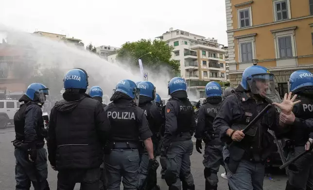 Lazio fans riot with police ahead of the Italian Serie A soccer match between Lazio and Roma at Rome's Olympic stadium, Sunday, April 13, 2025. (AP Photo/Gregorio Borgia)