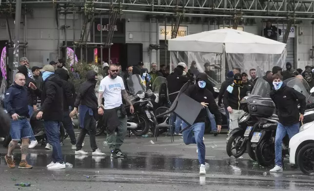 Lazio fans riot with police ahead of the Italian Serie A soccer match between Lazio and Roma at Rome's Olympic stadium, Sunday, April 13, 2025. (AP Photo/Gregorio Borgia)