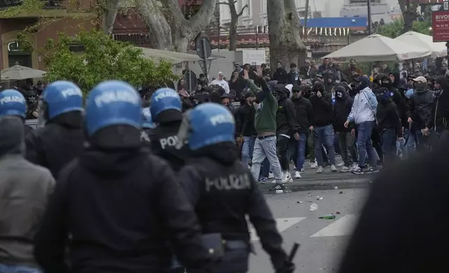 Lazio fans riot with police ahead of the Italian Serie A soccer match between Lazio and Roma at Rome's Olympic stadium, Sunday, April 13, 2025. (AP Photo/Gregorio Borgia)
