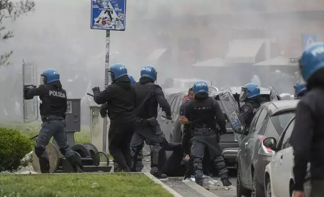Lazio fans riot with police ahead of the Italian Serie A soccer match between Lazio and Roma at Rome's Olympic stadium, Sunday, April 13, 2025. (AP Photo/Gregorio Borgia)