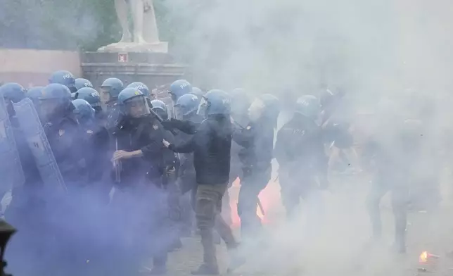Lazio fans riot with police ahead of the Italian Serie A soccer match between Lazio and Roma at Rome's Olympic stadium, Sunday, April 13, 2025. (AP Photo/Gregorio Borgia)