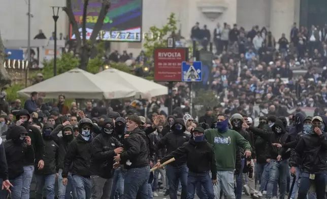 Lazio fans riot with police ahead of the Italian Serie A soccer match between Lazio and Roma at Rome's Olympic stadium, Sunday, April 13, 2025. (AP Photo/Gregorio Borgia)