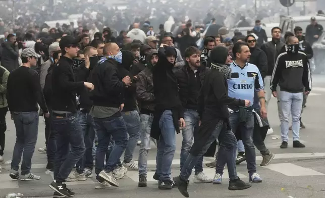 Lazio fans riot with police ahead of the Italian Serie A soccer match between Lazio and Roma at Rome's Olympic stadium, Sunday, April 13, 2025. (AP Photo/Gregorio Borgia)