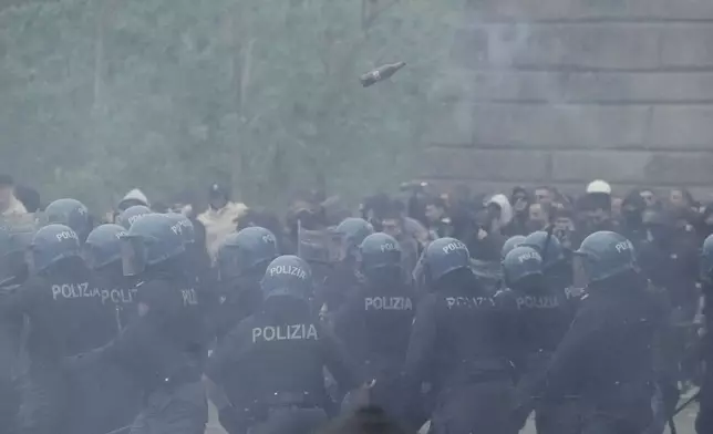Lazio fans riot with police ahead of the Italian Serie A soccer match between Lazio and Roma at Rome's Olympic stadium, Sunday, April 13, 2025. (AP Photo/Gregorio Borgia)