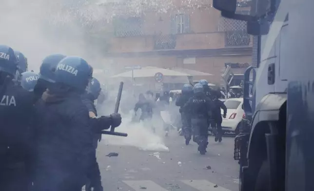Lazio fans riot with police ahead of the Italian Serie A soccer match between Lazio and Roma at Rome's Olympic stadium, Sunday, April 13, 2025. (AP Photo/Gregorio Borgia)