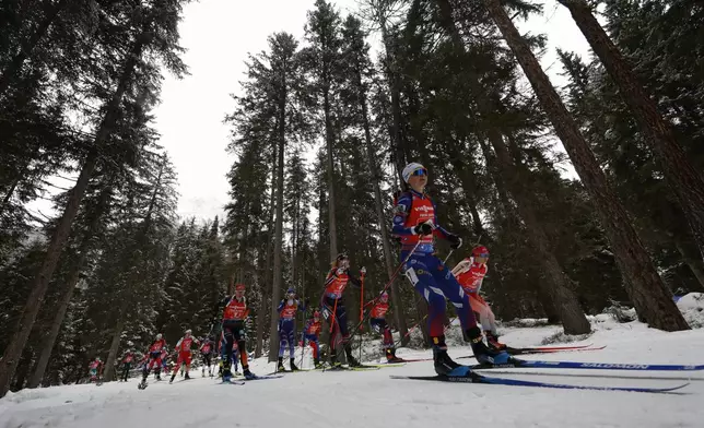 Athletes competes during a Biathlon women's World Cup 4x6km relay race, in Anterselva, Italy, Sunday, Jan. 26, 2025. (AP Photo/Alessandro Trovati)