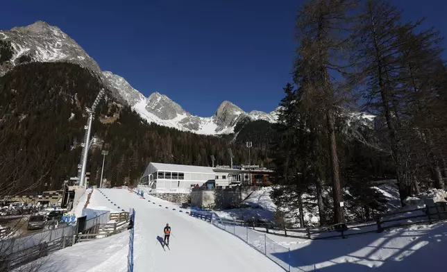 An athlete competes during a Biathlon World Cup event at the Anterselva Biathlon Arena, venue for the biathlon discipline at the Milan Cortina 2026 Winter Olympics, in Anterselva, northern Italy, Saturday, Jan. 25, 2025. (AP Photo/Alessandro Trovati)
