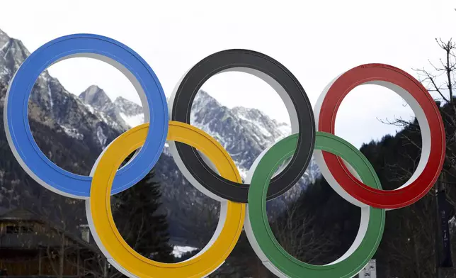Olympic rings are seen near the village of Anterselva where the biathlon discipline will take place during the Milan Cortina 2026 Winter Olympics, in northern Italy, Saturday, Jan. 25, 2025. (AP Photo/Alessandro Trovati)