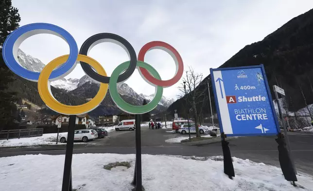Olympic rings are seen near the village of Anterselva where the biathlon discipline will take place during the Milan Cortina 2026 Winter Olympics, in northern Italy, Saturday, Jan. 25, 2025. (AP Photo/Alessandro Trovati)