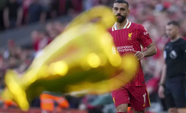 Liverpool's Mohamed Salah in action during the English Premier League soccer match between Liverpool and Tottenham Hotspur at Anfield in Liverpool, England, Sunday, April 27, 2025. (AP Photo/Jon Super)