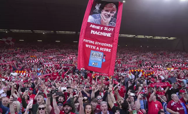 Liverpool supporters celebrate after their team won the English Premier League soccer match between Liverpool and Tottenham Hotspur and clinched the Premier League title at Anfield in Liverpool, England, Sunday, April 27, 2025. (AP Photo/Jon Super)