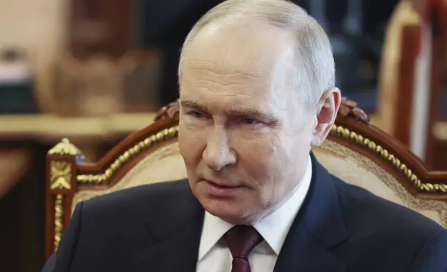 Russian President Vladimir Putin speaks with Russian Chief of General Staff Gen. Valery Gerasimov during their meeting at the Kremlin in Moscow, Russia, Saturday, April 19, 2025. (Vyacheslav Prokofyev, Sputnik, Kremlin Pool Photo via AP)
