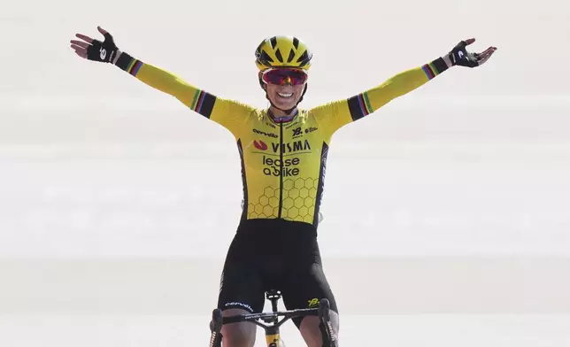 Pauline Ferrand Prevot, of France, crosses the finish line to win the Paris-Roubaix cycling race in Roubaix, France, Saturday, April 12, 2025. (AP Photo/Thibault Camus)