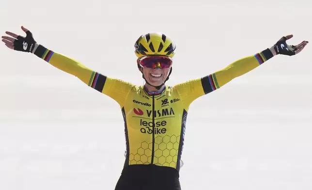 Pauline Ferrand Prevot, of France, crosses the finish line to win the Paris-Roubaix cycling race in Roubaix, France, Saturday, April 12, 2025. (AP Photo/Thibault Camus)