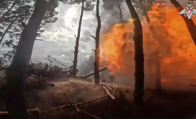 In this photo taken from video distributed by Russian Defense Ministry Press Service on Sunday, April 27, 2025, a Russian Army 152mm howitzer Giatsint-B fires towards Ukrainian positions in Kherson, Ukraine. (Russian Defense Ministry Press Service via AP)
