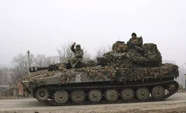 FILE - In this image made from a video distributed by the Russian Defense Ministry Press Service on Friday, March 14, 2025, Russian soldiers ride on a self-propelled gun in Russia's Kursk region. (Russian Defense Ministry Press Service via AP, File)